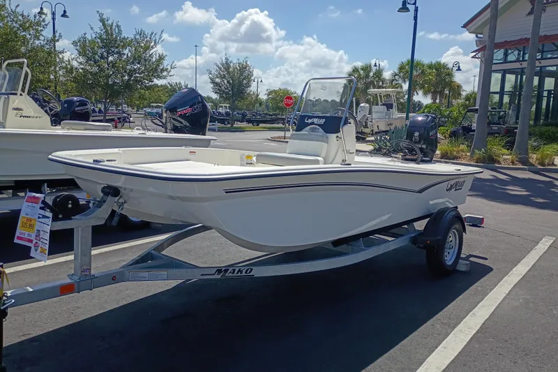 The Image of 2026 Mako Pro Skiff 15 CC boat on trailer in outdoor showroom. - 0
