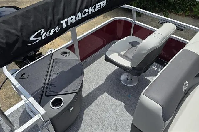 Slide: The Image of 2026 Sun Tracker Bass Buggy 18 DLX boat interior with seating and storage. - 9