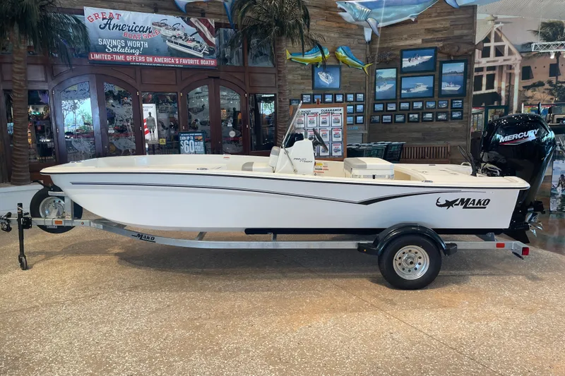 The Image of 2026 Mako Pro Skiff 17 CC boat displayed indoors on a trailer. - 0