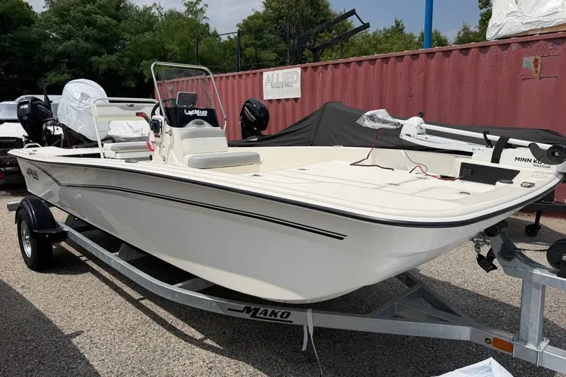 Slide: The Image of 2026 Mako Pro Skiff 17 CC boat on trailer, parked outdoors. - 57