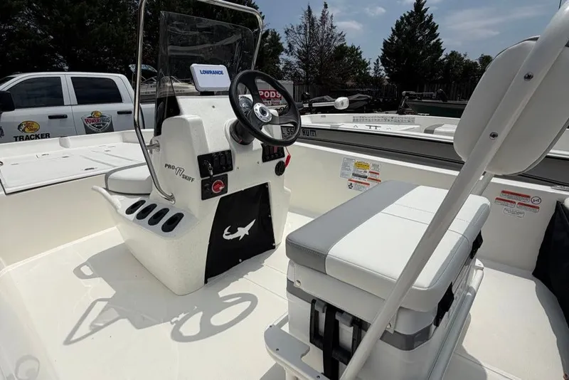 Slide: The Image of 2026 Mako Pro Skiff 17 CC boat interior with steering console and seating. - 59