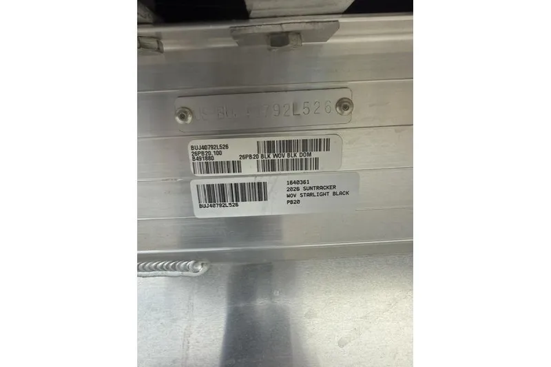 Slide: The Image of 2026 Sun Tracker Party Barge 20 DLX identification plate with serial numbers and model details. - 9