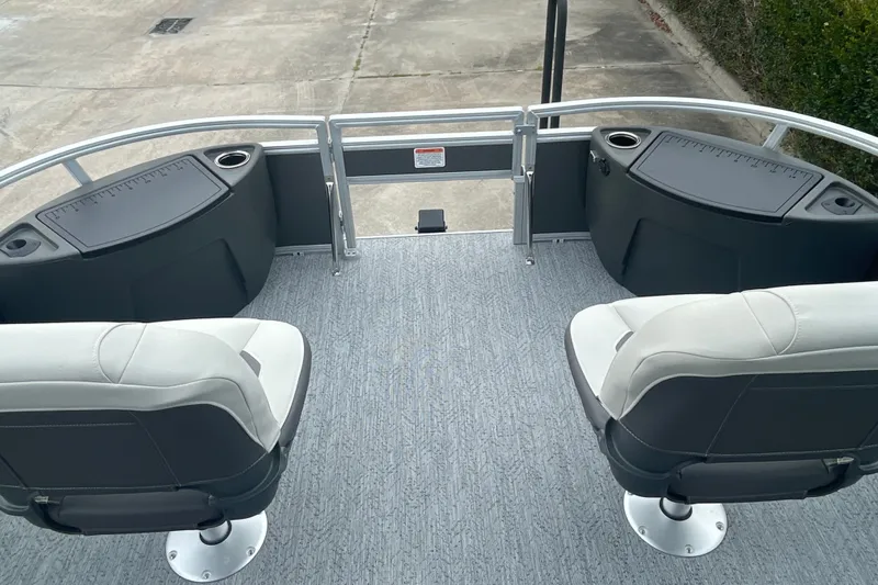 Slide: The Image of 2026 Sun Tracker Bass Buggy 18 DLX pontoon boat with dual seating and storage compartments. - 10