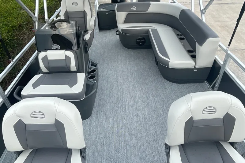 Slide: The Image of 2026 Sun Tracker Bass Buggy 18 DLX pontoon boat interior with gray and white seating. - 9