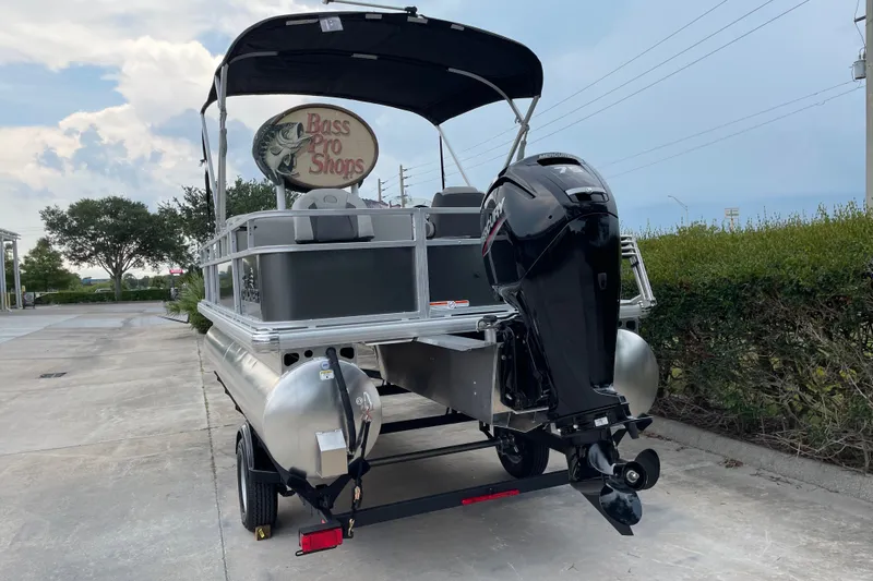 Slide: The Image of 2026 Sun Tracker Bass Buggy 18 DLX pontoon boat with Mercury outboard motor. - 3