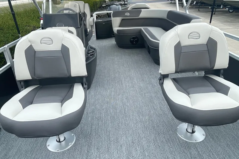 Slide: The Image of 2026 Sun Tracker Bass Buggy 18 DLX interior with gray and white seating. - 8