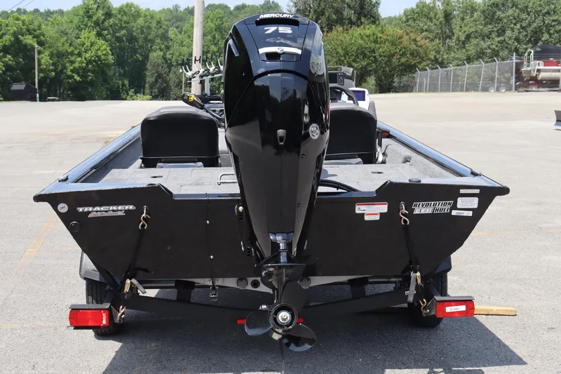 Slide: The Image of 2026 Tracker Pro Team 175 Crappie Edition boat with Mercury 75 engine, parked outdoors. - 8