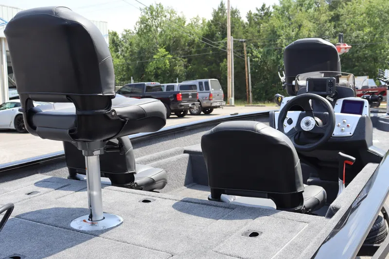Slide: The Image of 2026 Tracker Pro Team 175 Crappie Edition boat interior with seating and steering console. - 4