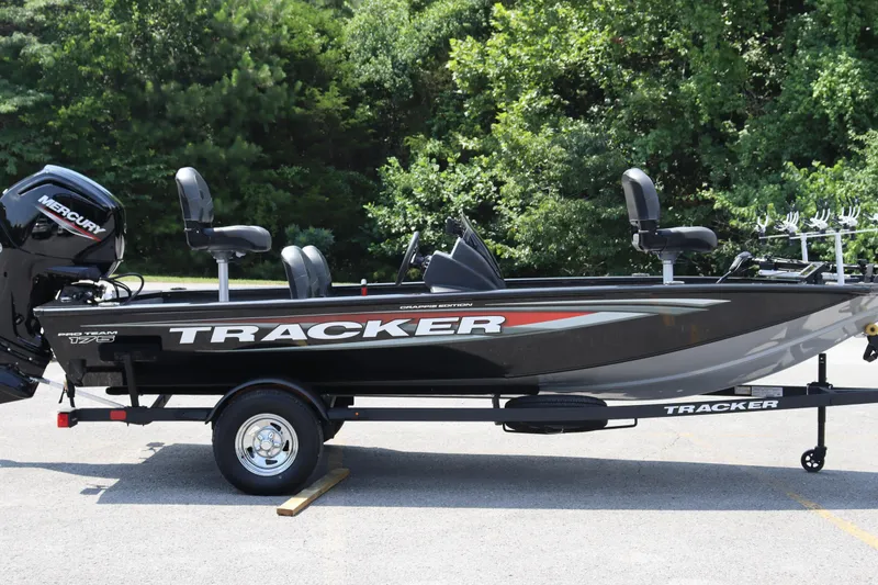 Slide: The Image of 2026 Tracker Pro Team 175 Crappie Edition boat on trailer, parked outdoors. - 6