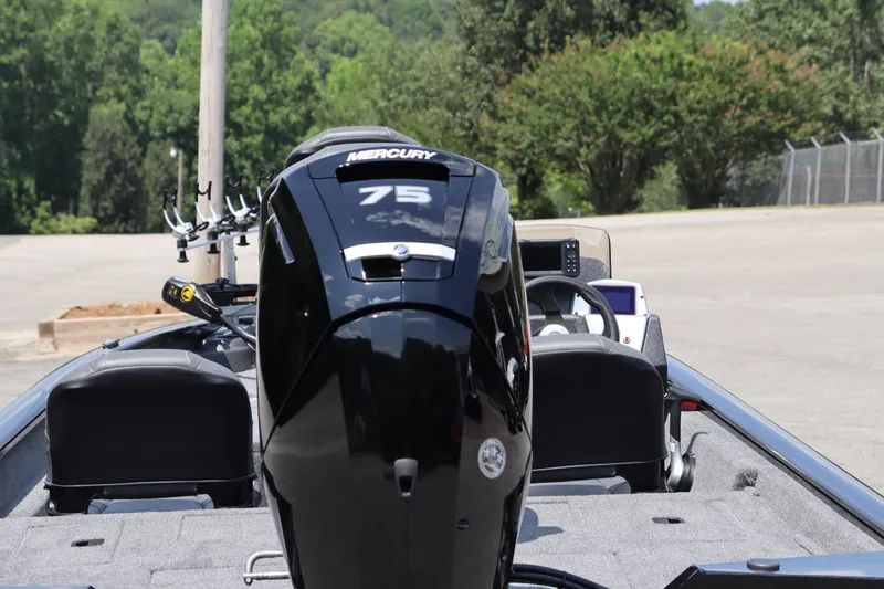 Slide: The Image of 2026 Tracker Pro Team 175 Crappie Edition boat with Mercury 75 engine, parked outdoors. - 9