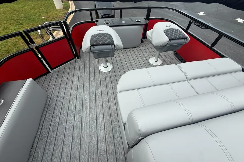 Slide: The Image of 2026 Ranger 223F boat interior with gray seating and red accents. - 7
