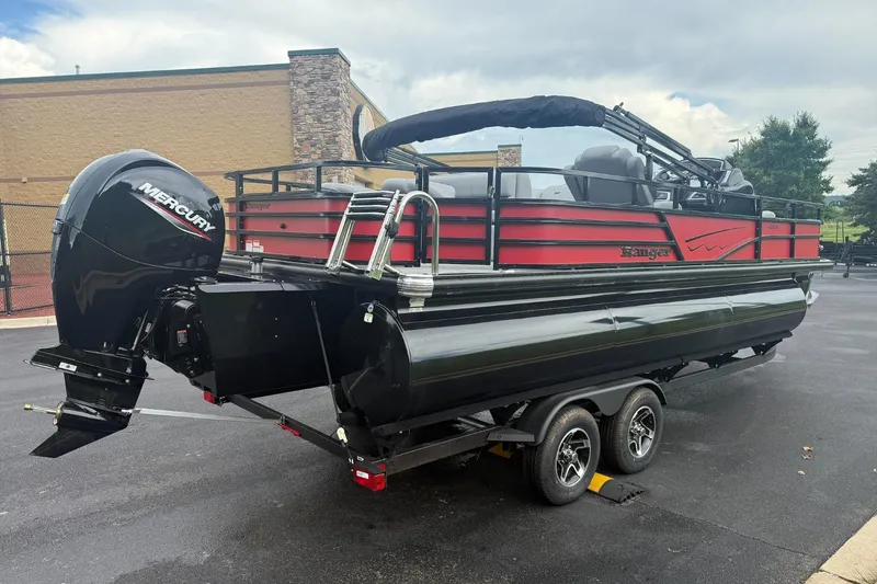 Slide: The Image of 2026 Ranger 223F pontoon boat with Mercury outboard motor on a trailer. - 4