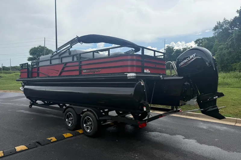 Slide: The Image of 2026 Ranger 223F pontoon boat with Mercury outboard engine on a trailer. - 2