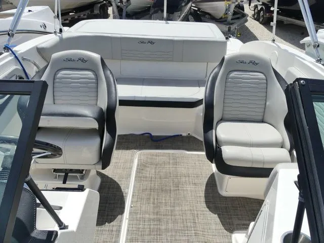 Slide: The Image of Interior of a Sea Ray SPX 190 Outboard with gray and white seating. - 11