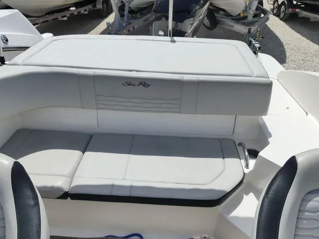 Slide: The Image of The image shows the cockpit of a 2021 Sea Ray SPX 190 Outboard with gray upholstery. - 6