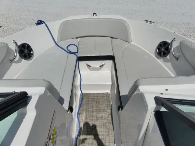Slide: The Image of The image shows the bow area of a Sea Ray SPX 190 Outboard boat with gray upholstery. - 12