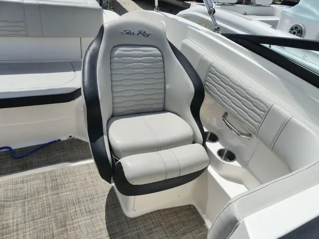 Slide: The Image of The 2021 Sea Ray SPX 190 Outboard features sleek gray and black upholstery with a quilted pattern. - 10