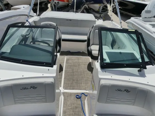 Slide: The Image of The image shows the cockpit of a Sea Ray SPX 190 Outboard boat with gray seating. - 15
