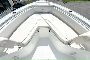 Slide: The Image of 2024 Sea Hunt Ultra 239 SE boat with spacious seating and sleek design. - 11