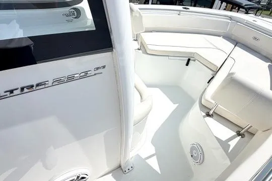 Slide: The Image of 2024 Sea Hunt Ultra 239 SE boat interior with white seating and sleek design. - 26
