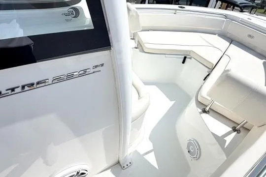 Slide: The Image of 2024 Sea Hunt Ultra 239 SE boat interior with white seating and sleek design. - 25