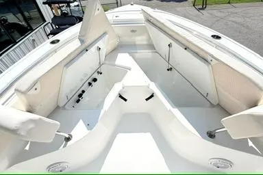 Slide: The Image of 2024 Sea Hunt Ultra 239 SE boat interior with open storage compartments. - 9
