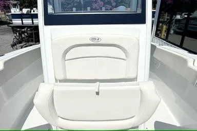 Slide: The Image of 2024 Sea Hunt Ultra 239 SE boat interior with cushioned seating and sleek design. - 13