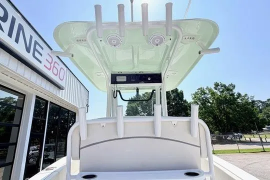 Slide: The Image of 2024 Sea Hunt Ultra 239 SE boat with rod holders and canopy at Marine 360 dealership. - 17