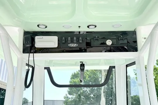 Slide: The Image of 2024 Sea Hunt Ultra 239 SE boat console with modern controls and navigation equipment. - 20