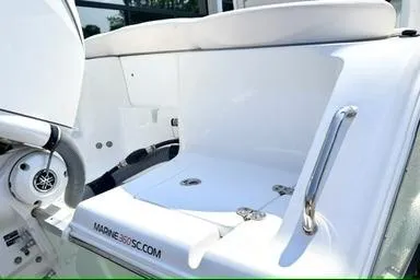 Slide: The Image of 2024 Sea Hunt Ultra 239 SE boat interior, featuring sleek white seating and modern design elements. - 4