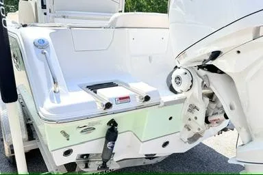 Slide: The Image of 2024 Sea Hunt Ultra 239 SE boat stern with outboard motor, showcasing sleek design. - 5