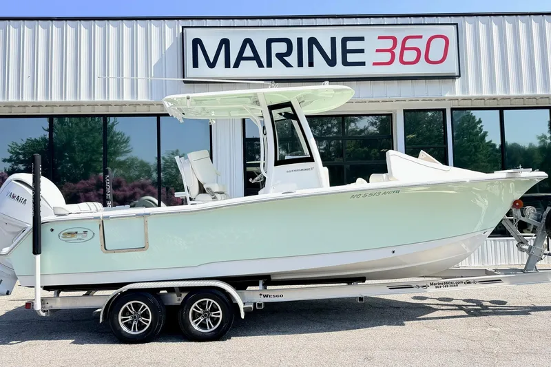 Slide: The Image of 2024 Sea Hunt Ultra 239 SE boat on trailer at Marine 360 dealership. - 2