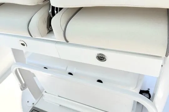 Slide: The Image of 2024 Sea Hunt Ultra 239 SE boat seating and storage compartment detail. - 23