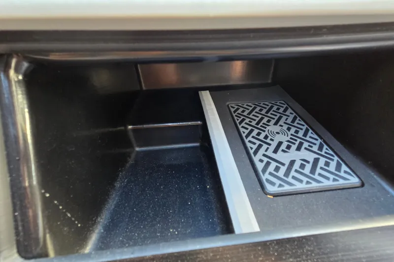 Slide: The Image of Storage compartment with patterned mat in 2024 Godfrey Sweetwater 2486 SB boat. - 47