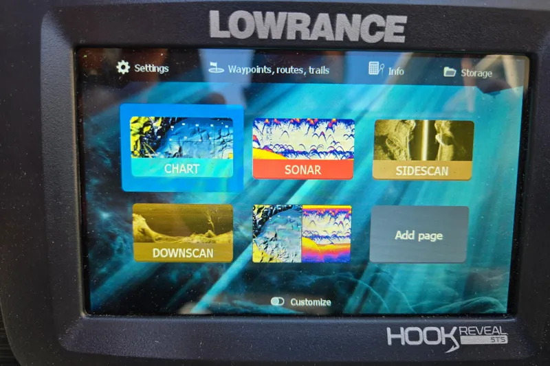 Slide: The Image of Lowrance Hook Reveal 5TS display on 2024 Godfrey Sweetwater 2486 SB, showing chart, sonar, sidescan options. - 39