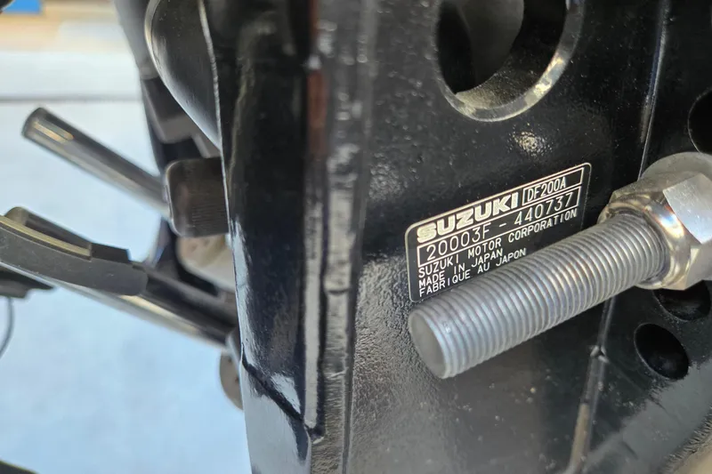 Slide: The Image of Close-up of Suzuki DF200A engine label on 2024 Godfrey Sweetwater 2486 SB boat. - 49