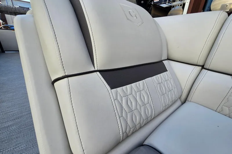 Slide: The Image of 2024 Godfrey Sweetwater 2486 SB boat seat with elegant stitching and logo detail. - 30
