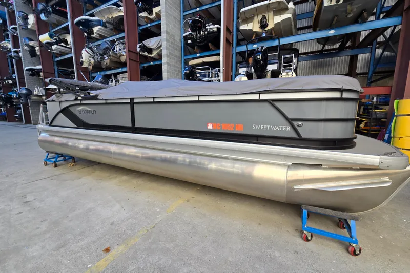 The Image of 2024 Godfrey Sweetwater 2486 SB pontoon boat in storage facility. - 0