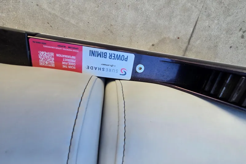 Slide: The Image of 2024 Godfrey Sweetwater 2486 SB boat with Surshade Power Bimini label and QR code. - 51