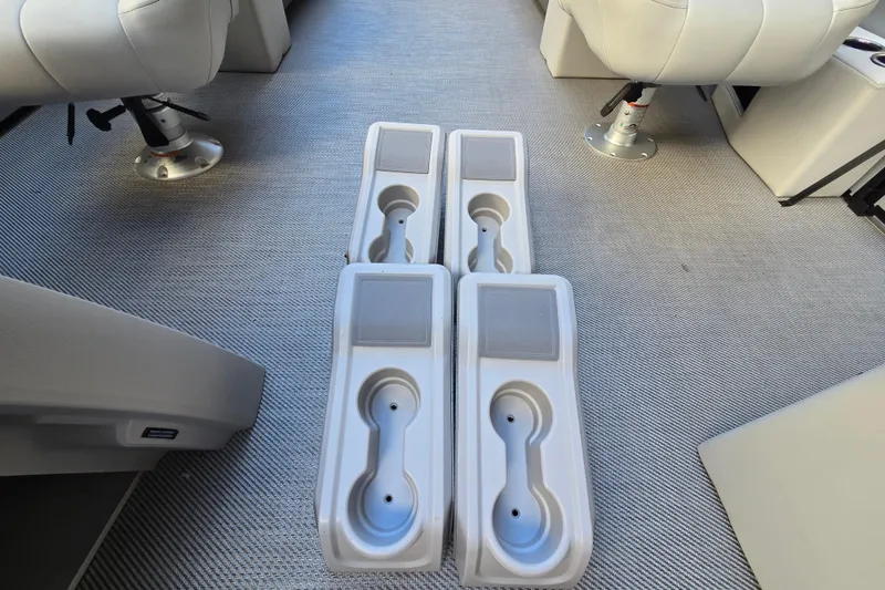 Slide: The Image of Interior of 2024 Godfrey Sweetwater 2486 SB boat with cup holders and seating. - 32