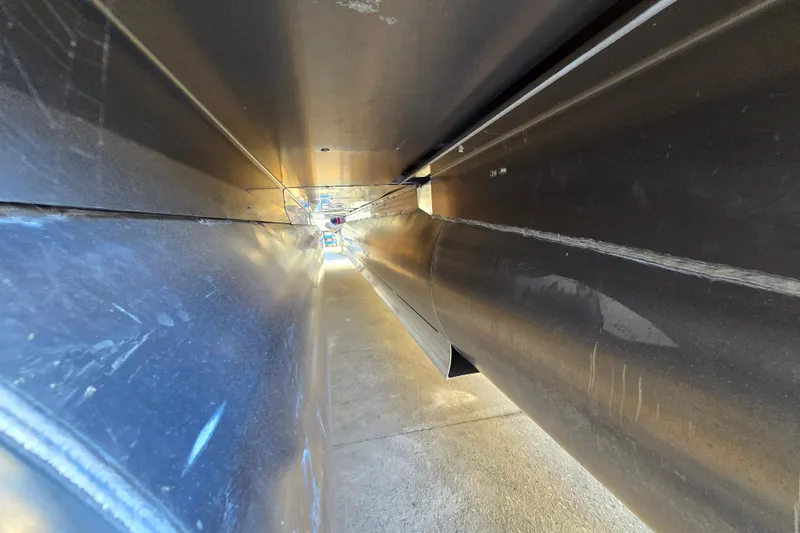 Slide: The Image of Underneath view of 2024 Godfrey Sweetwater 2486 SB pontoon boat, showcasing structural details. - 12