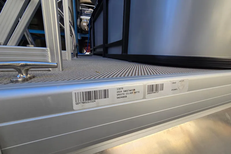 Slide: The Image of 2024 Godfrey Sweetwater 2486 SB pontoon, smooth silver matte finish, barcode visible. - 54