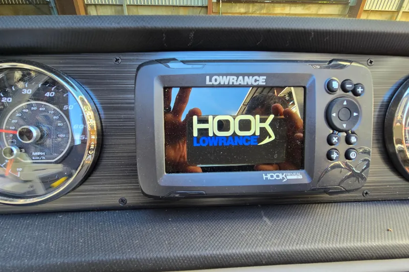 Slide: The Image of Lowrance Hook Reveal GPS on 2024 Godfrey Sweetwater 2486 SB dashboard. - 36