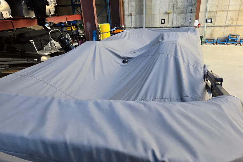 Slide: The Image of Covered 2024 Godfrey Sweetwater 2486 SB boat in storage facility. - 19