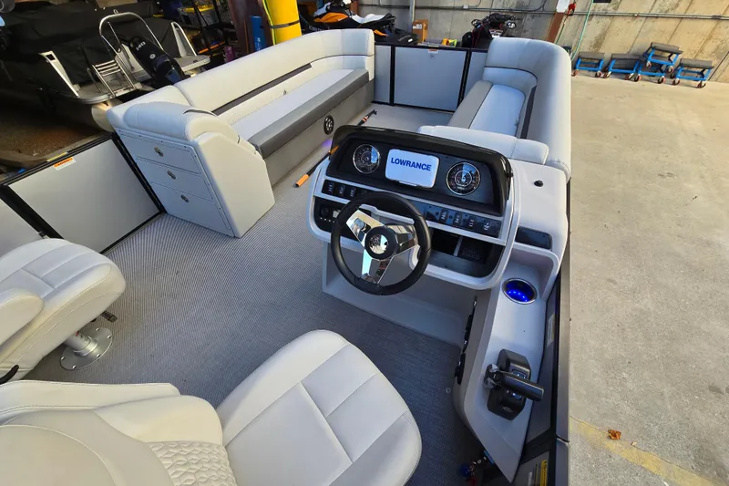 Slide: The Image of Interior of 2024 Godfrey Sweetwater 2486 SB pontoon boat with modern helm and seating. - 25