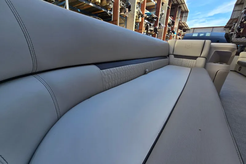 Slide: The Image of 2024 Godfrey Sweetwater 2486 SB boat interior with luxurious seating and modern design. - 24