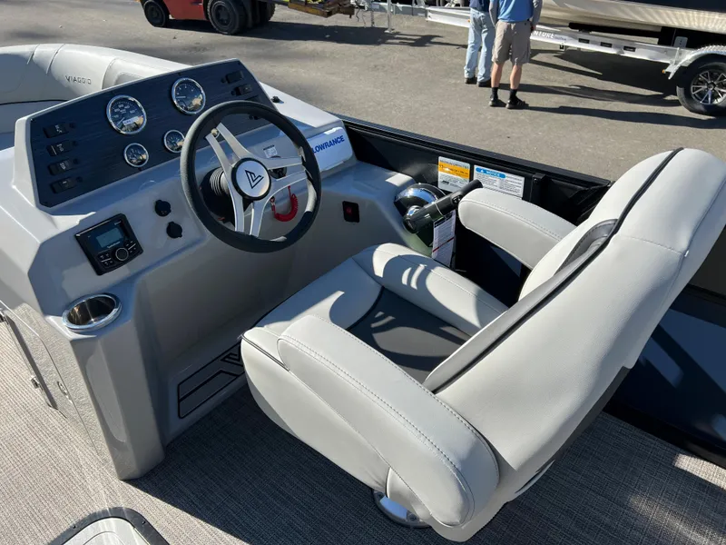 Slide: The Image of The image shows the helm of a 2023 Viaggio Lago 22U Tri Toon boat. - 15