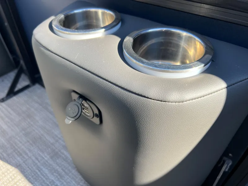 Slide: The Image of Close-up of two stainless steel cup holders on a padded boat seat. - 14