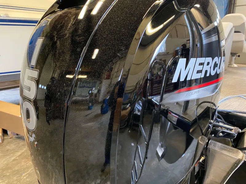 Slide: The Image of Close-up of a Mercury 150 outboard motor in a workshop. - 5