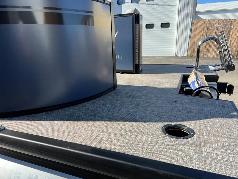 Slide: The Image of The image shows the deck of a 2023 Viaggio Lago 22U Tri Toon. - 8